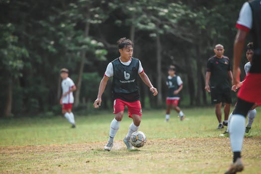 Action-packed youth soccer game on a sunny day with players in motion.