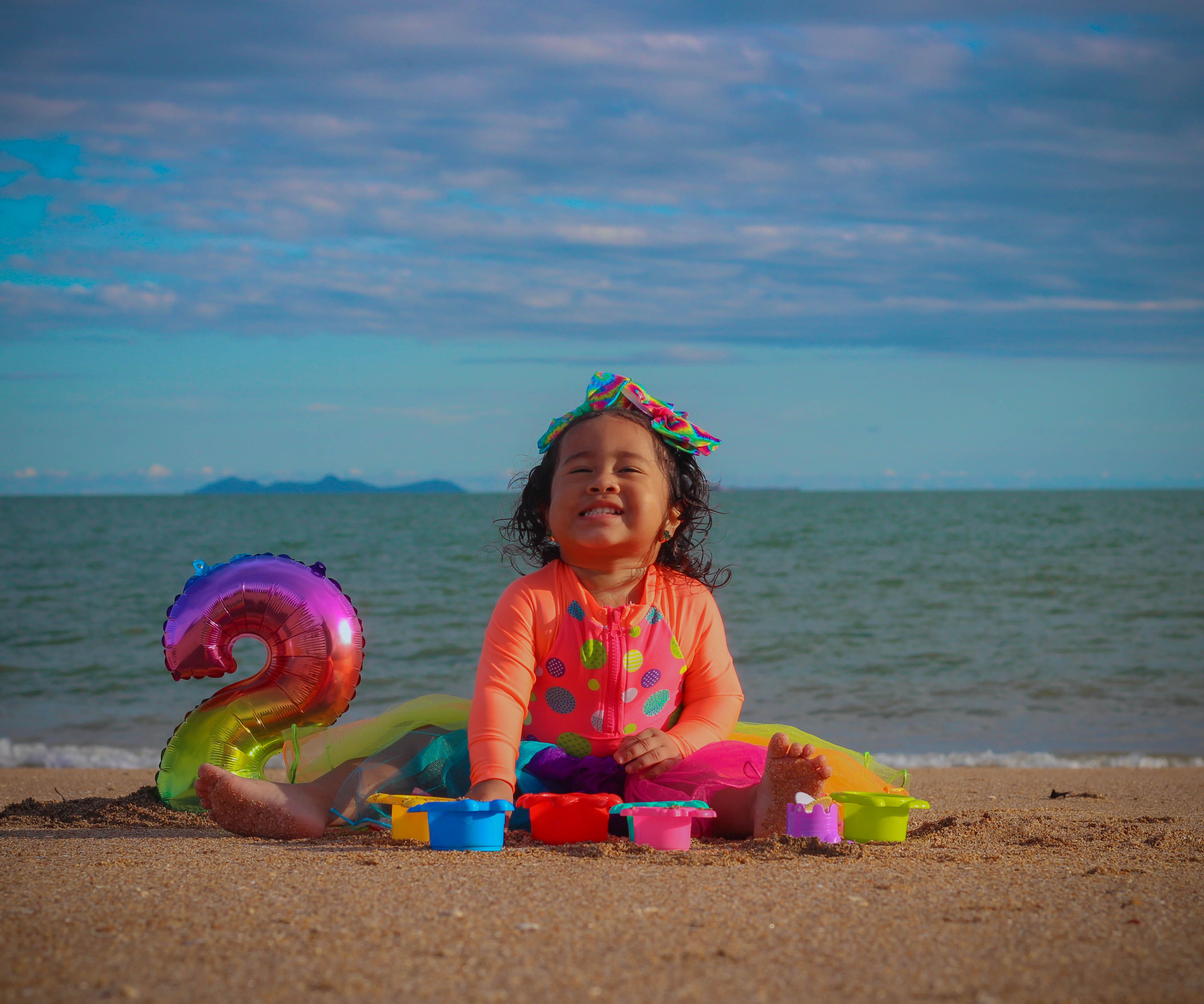 happy toddler family vacation beach relaxed