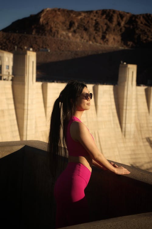 Tourist in Pink Sports Bra and Leggings Admire the View From the Hoover Dam
