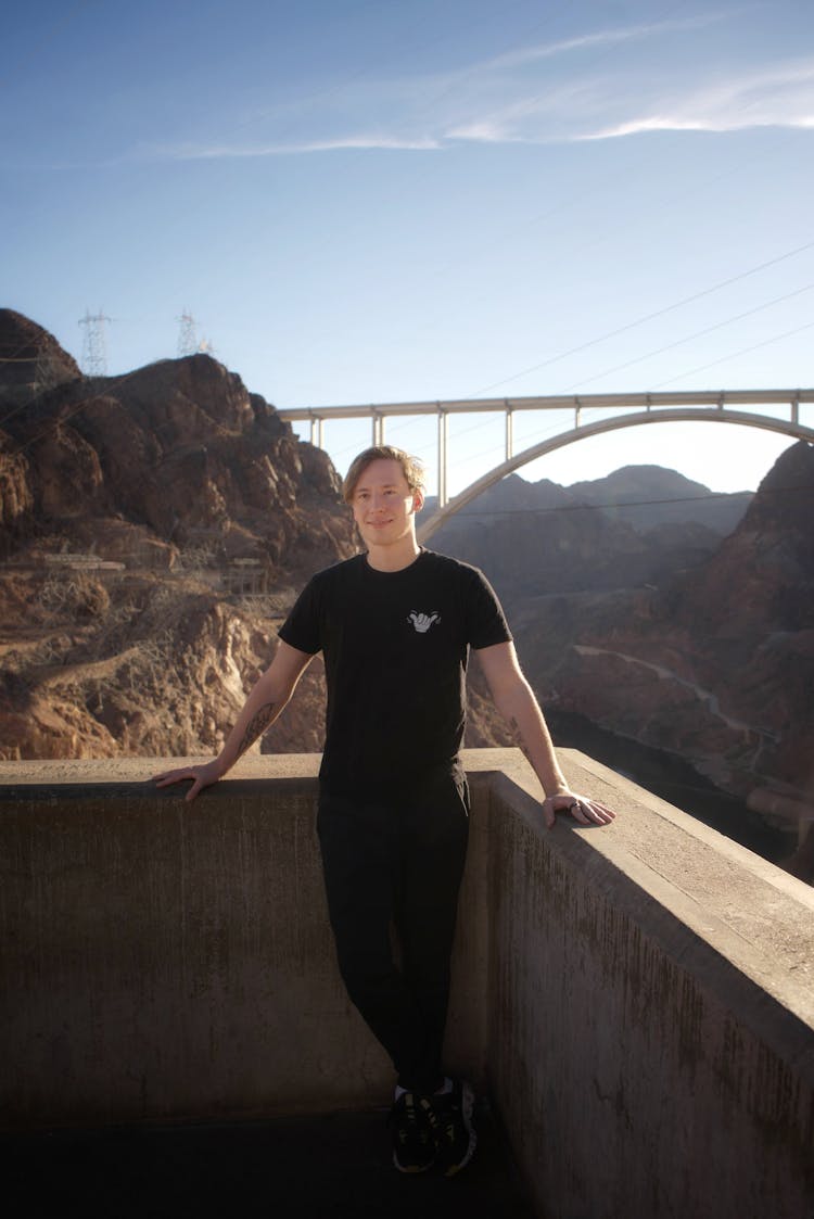 Tourist At The Hoover Dam With The Mike OCallaghan–Pat Tillman Memorial Bridge In The Background