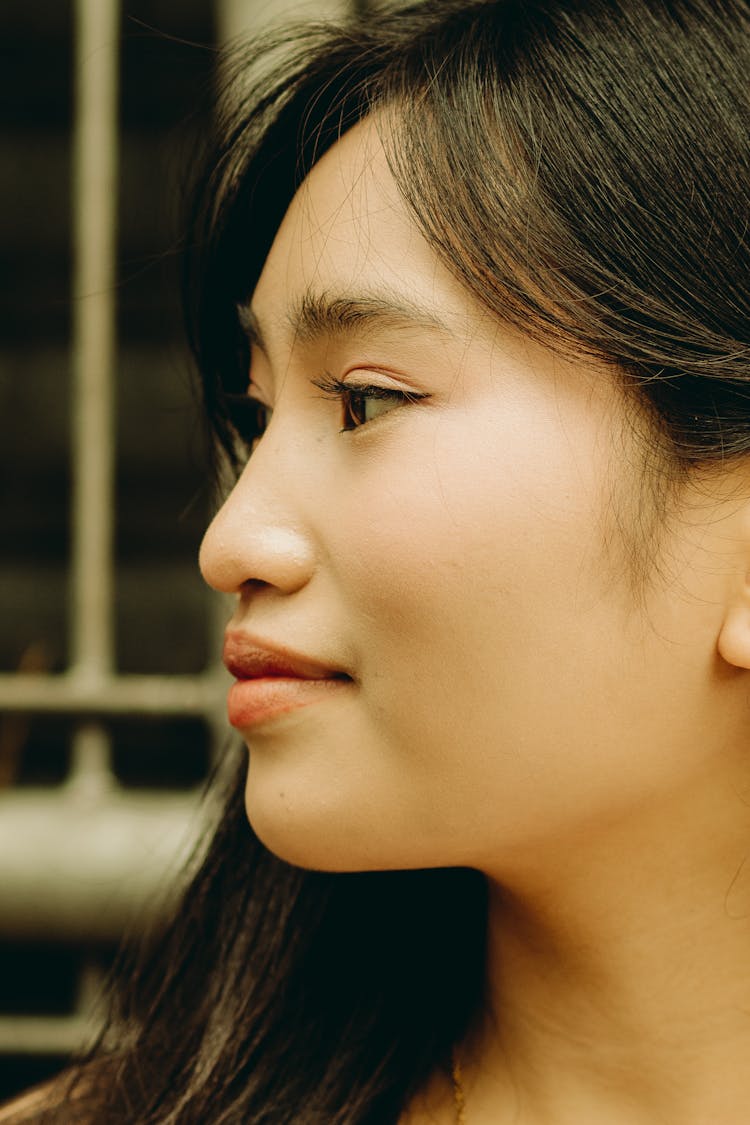 Young Smiling Woman In Profile