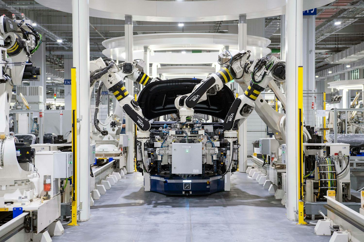 High-tech robots assembling a car in a modern factory setting
