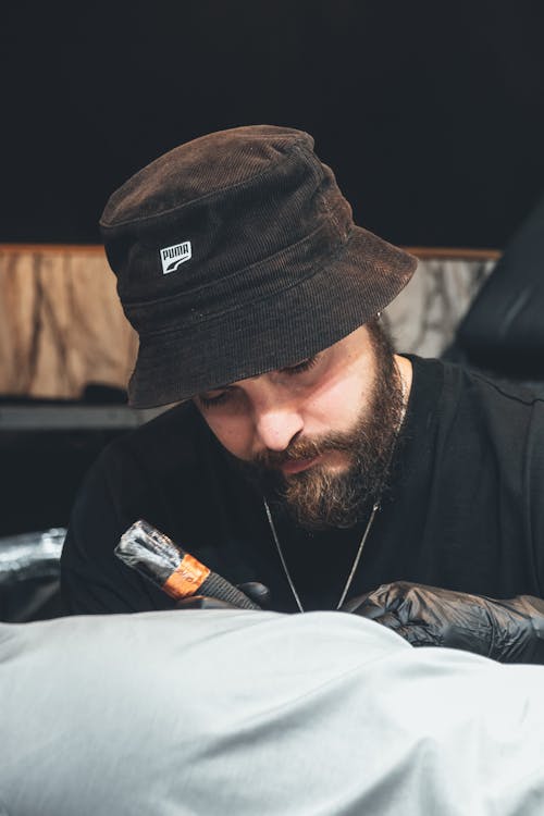 Tattoeer with Beard and in Hat