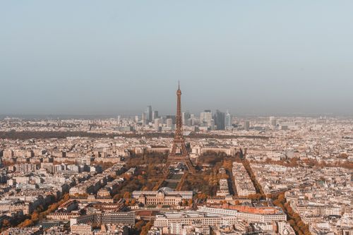Free Aerial view of Paris featuring the iconic Eiffel Tower and vibrant city life. Stock Photo