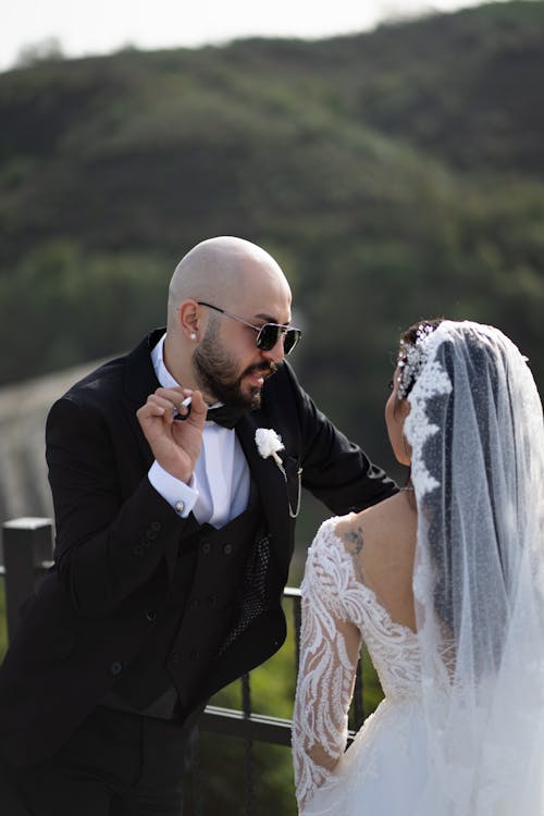 Newlywed Couple Standing Together Face to Face 