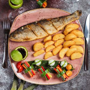 Fried fish with crispy potato wedges — photo by Farhad Ibrahimzade on Pexels