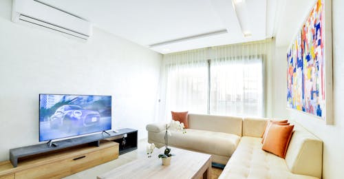 Bright Living Room Interior with a TV Set