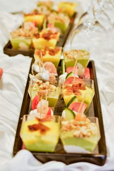 A vibrant assortment of mini appetizers beautifully arranged on a tray, perfect for events.