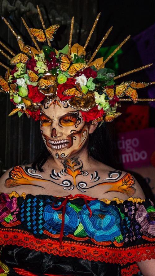 Free Colorful Dia de Muertos Catrina portrait with detailed face paint and floral headdress in Puebla, México. Stock Photo