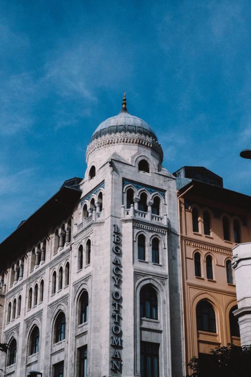 Free Legacy Ottoman Hotel featuring classic Ottoman architecture against a clear sky. Stock Photo