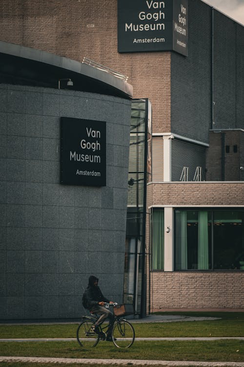 Cyclist Passing by Van Gogh Museum in Amsterdam
