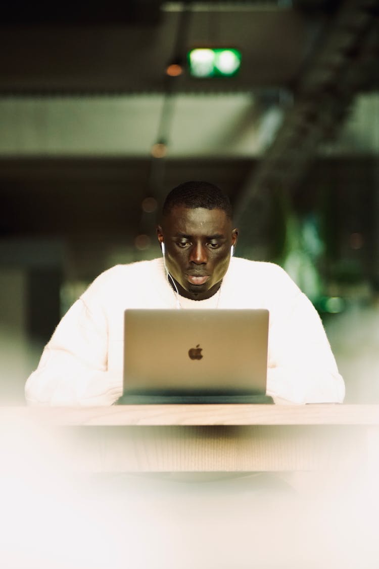 Man Working On Apple MacBook Pro Laptop