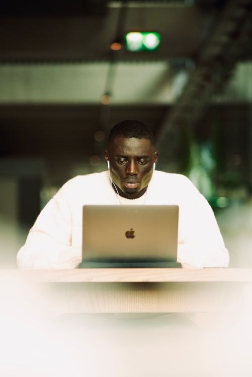 Man Working on Apple MacBook Pro Laptop · Free Stock Photo