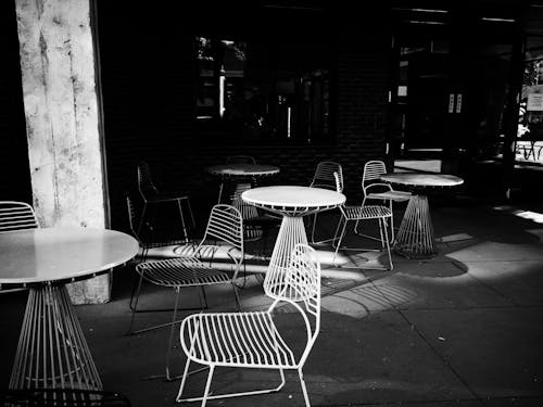 Chairs and Tables in a Restaurant in Black and White