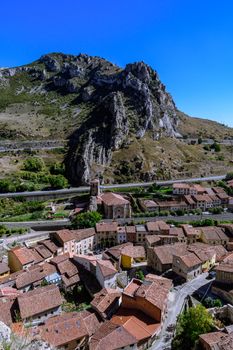 Picturesque aerial view of Pancorbo village with mountains in the backdrop, capturing its rustic charm.