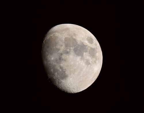 Free A detailed image of the moon's surface in the clear night sky. Stock Photo