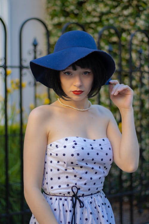 Brunette Woman with Necklace in White Dress