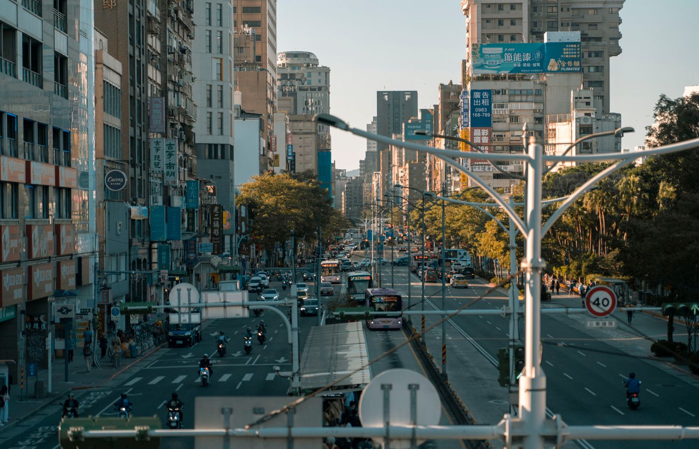A busy street scene showcasing the vibrant urban life in a modern cityscape.