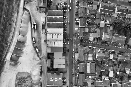 Black and white aerial shot of urban streets and buildings in Luton, UK.