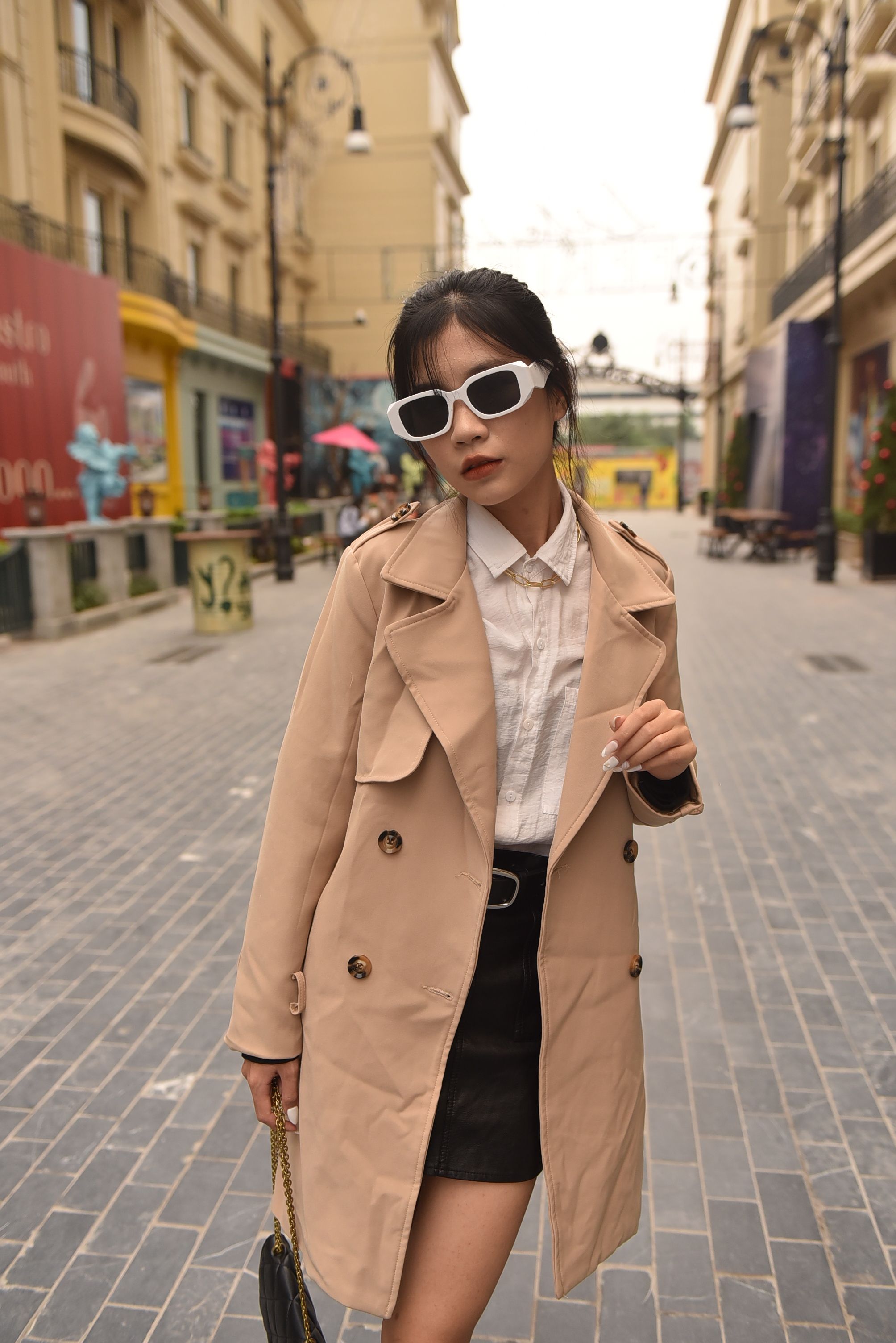 Woman Standing in Beige Trench Coat on Walkway · Free Stock Photo