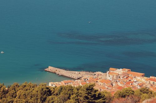 Free Stunning aerial view of Cefalù's coastline with charming architecture and blue waters. Stock Photo