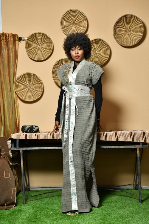 Woman with Afro Hairstyle Posing in a Gown 