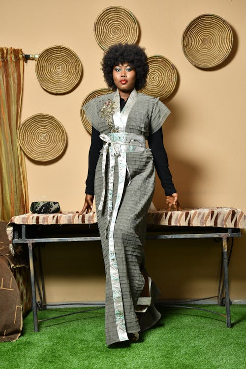 Woman with Afro Hairstyle Posing in a Gown 