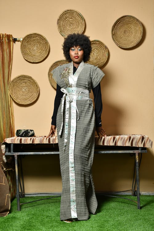 Woman with Afro Hairstyle Posing in a Gown 