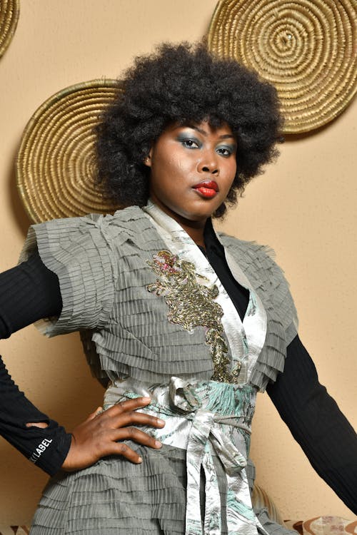 Woman with Afro Hairstyle Posing in a Gown 