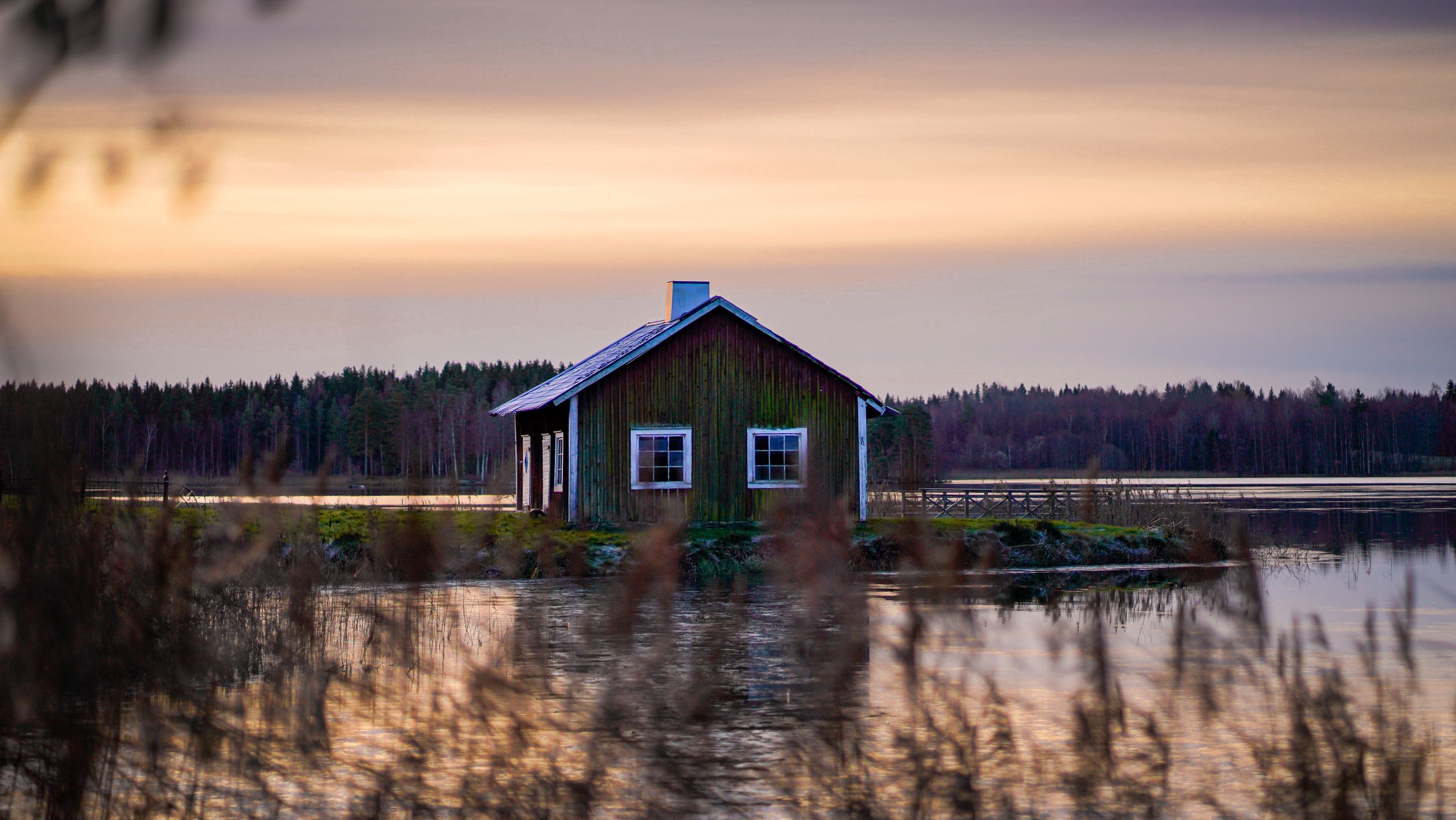 View of a Lakehouse on the Shore at Sunset · Free Stock Photo