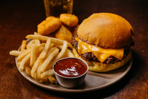 Burger, Fries and Chicken Nuggets on a Plate 