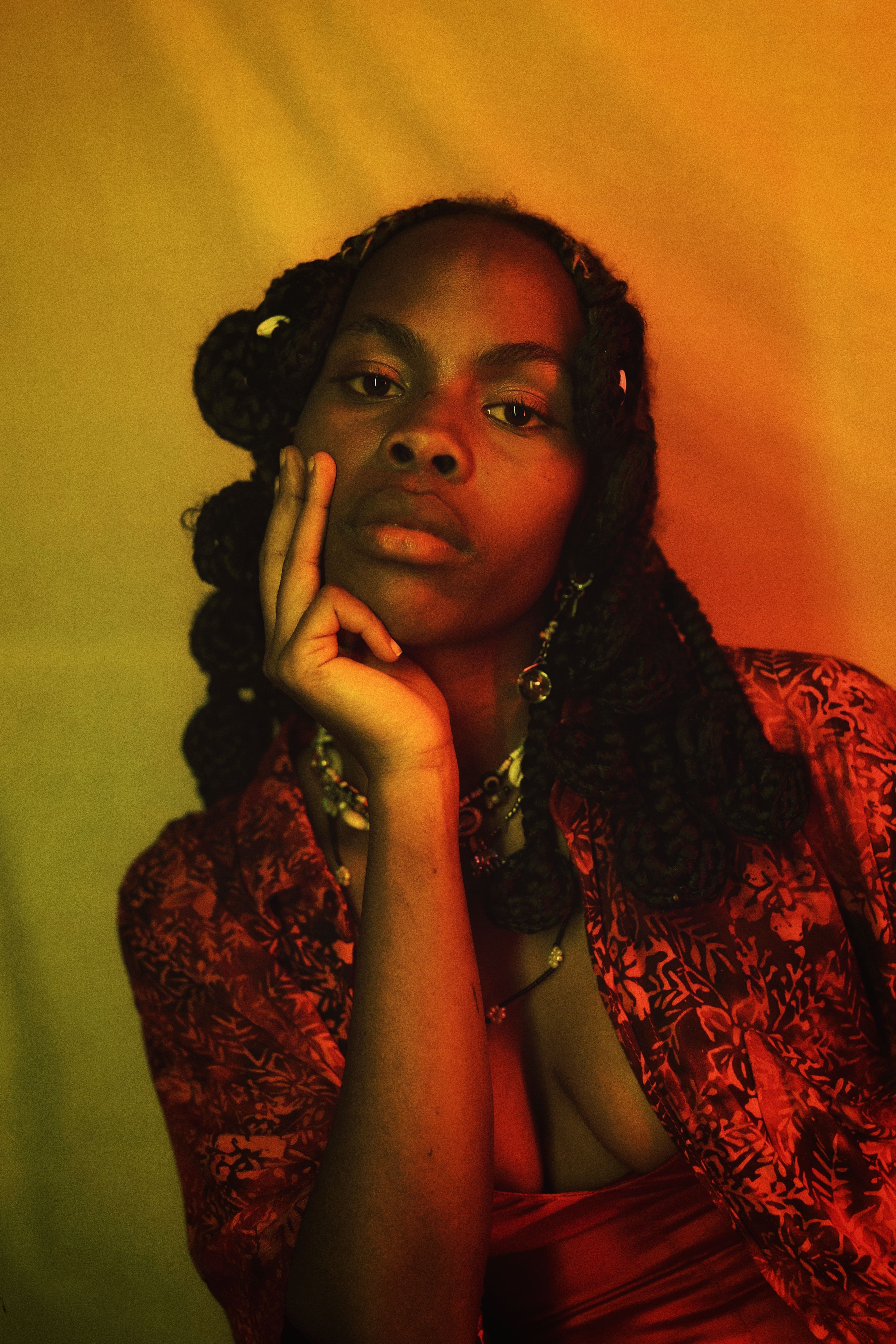 Elegant portrait of an African woman in studio lighting, showcasing fashion and style elegance.