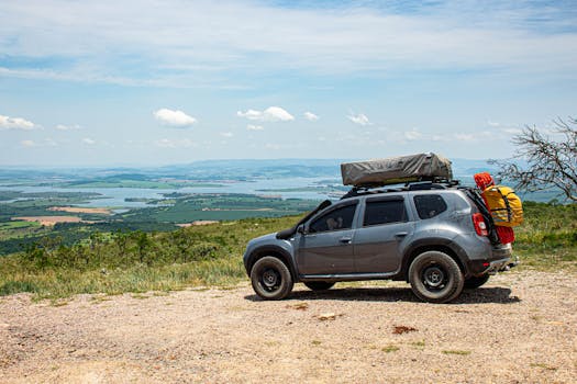 Explore Serra da Canastra with an SUV equipped for adventure on a scenic overlook.