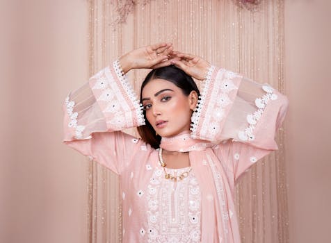 Portrait of a fashion model wearing an embroidered dress displaying elegance and style.