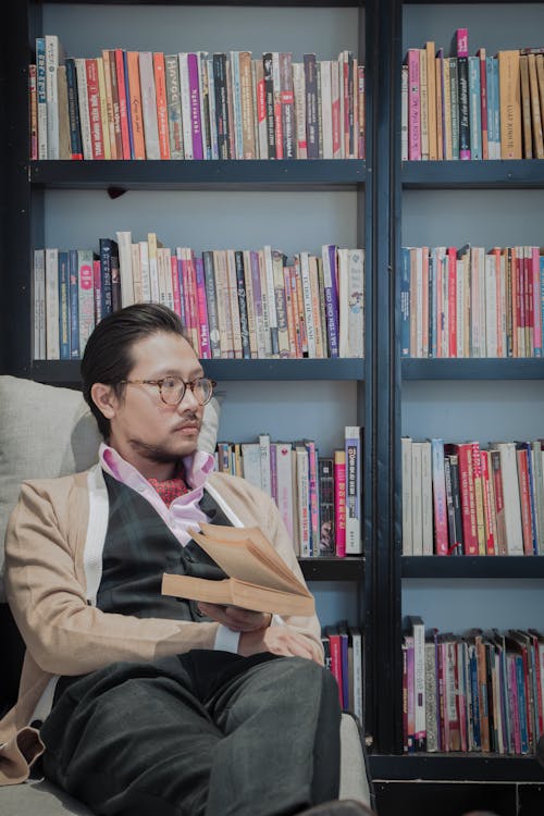 Man Sitting in a Library 