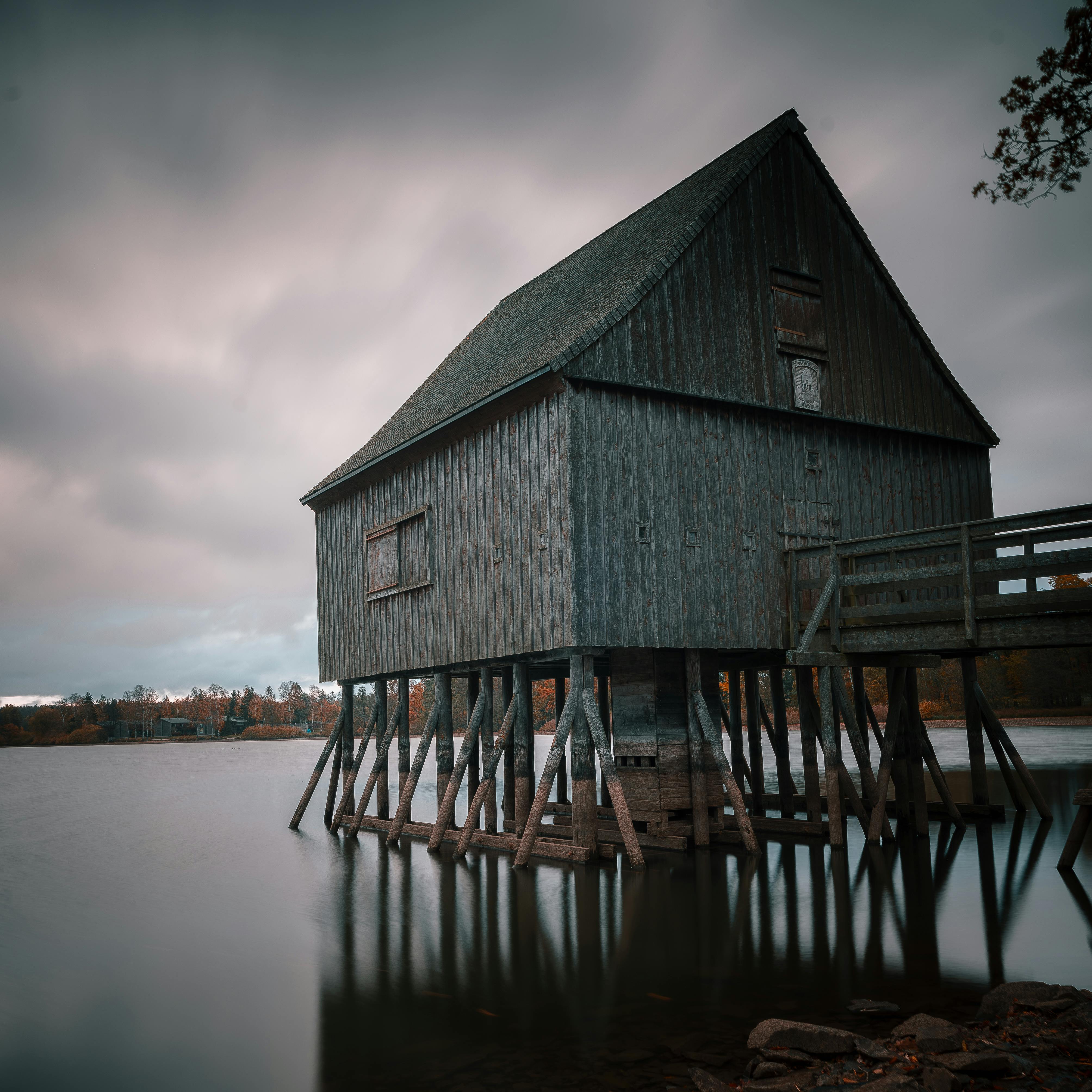 Abandoned Building on Pier on Lake