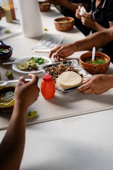 Family enjoying traditional Mexican tacos together in a casual dining setting.