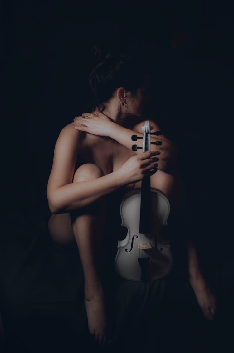 A Naked Woman With A Violin