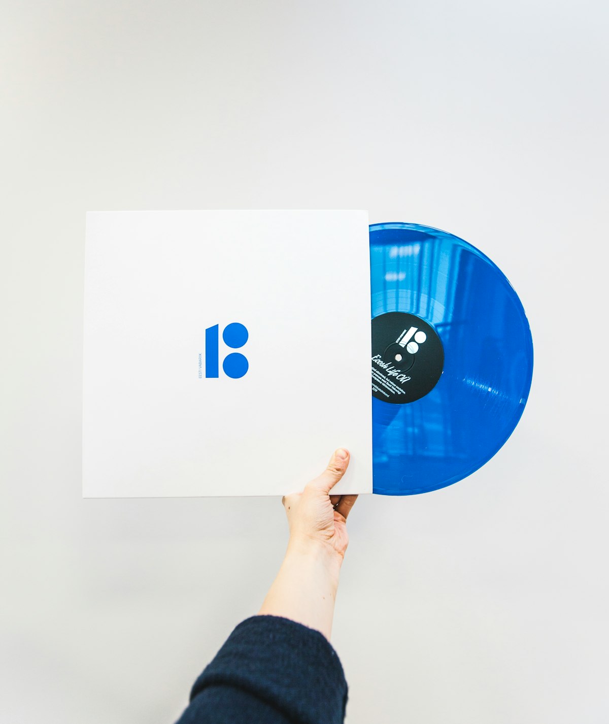 Blue coloured vinyl record with sleeve