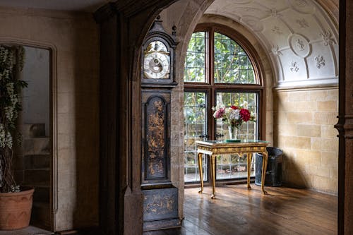 Vintage Interior with a Clock, and a Bouquet by the Window