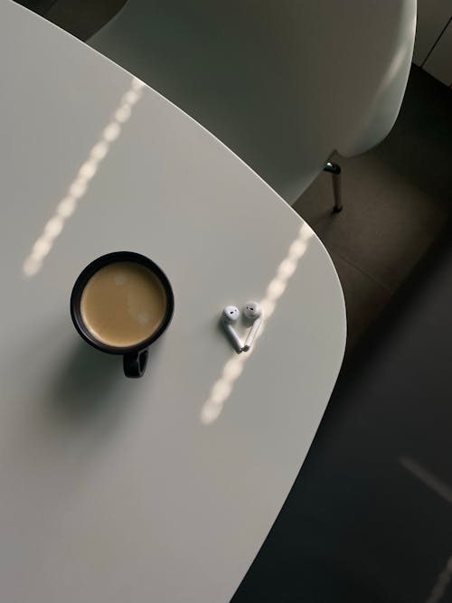 Table with Coffee and Airpods