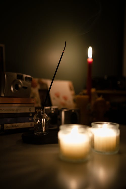 Wax Candles and Incense in Darkness