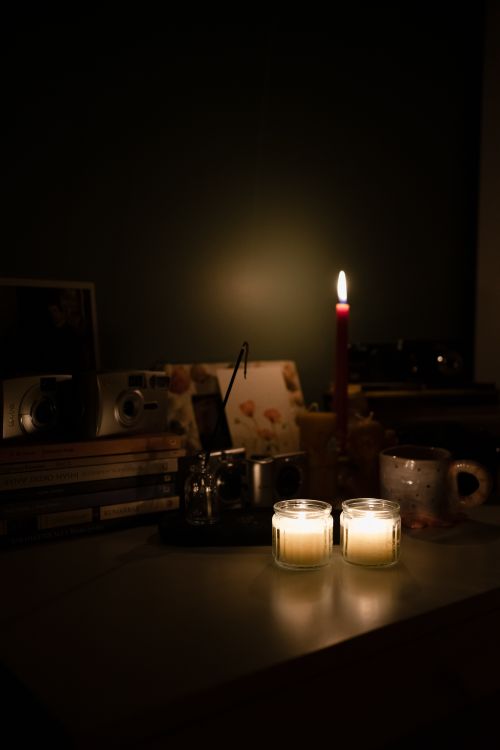Free Warm, candlelit ambiance with candles and books creating a cozy atmosphere in Ankara. Stock Photo