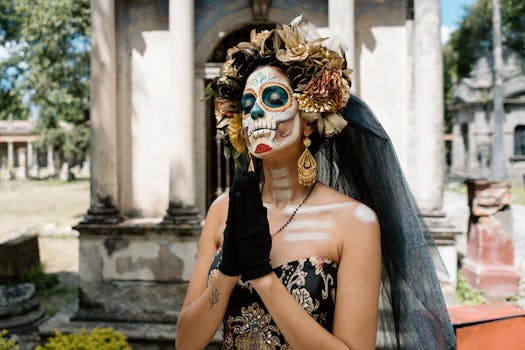 Woman in traditional Catrina makeup and attire during Day of the Dead festival in Guadalajara, Mexico.