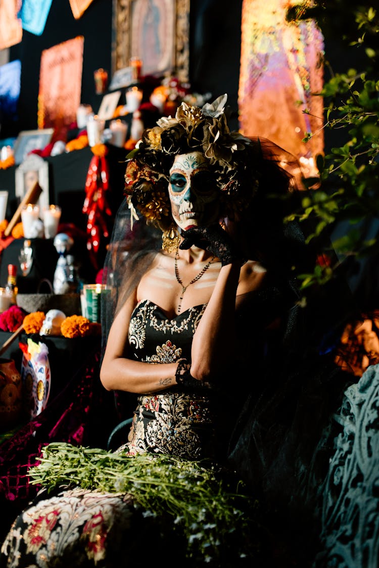 Woman Dressed As A Catrina Standing Among Decorations 