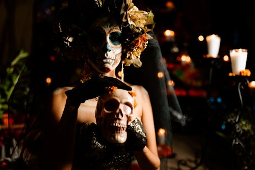 Catrina with a Serious Face Holding a Skull