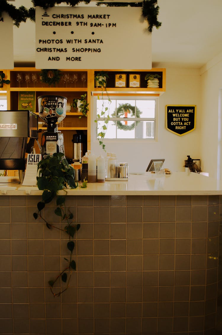 Board With A Christmas Announcement Above The Cafe Counter