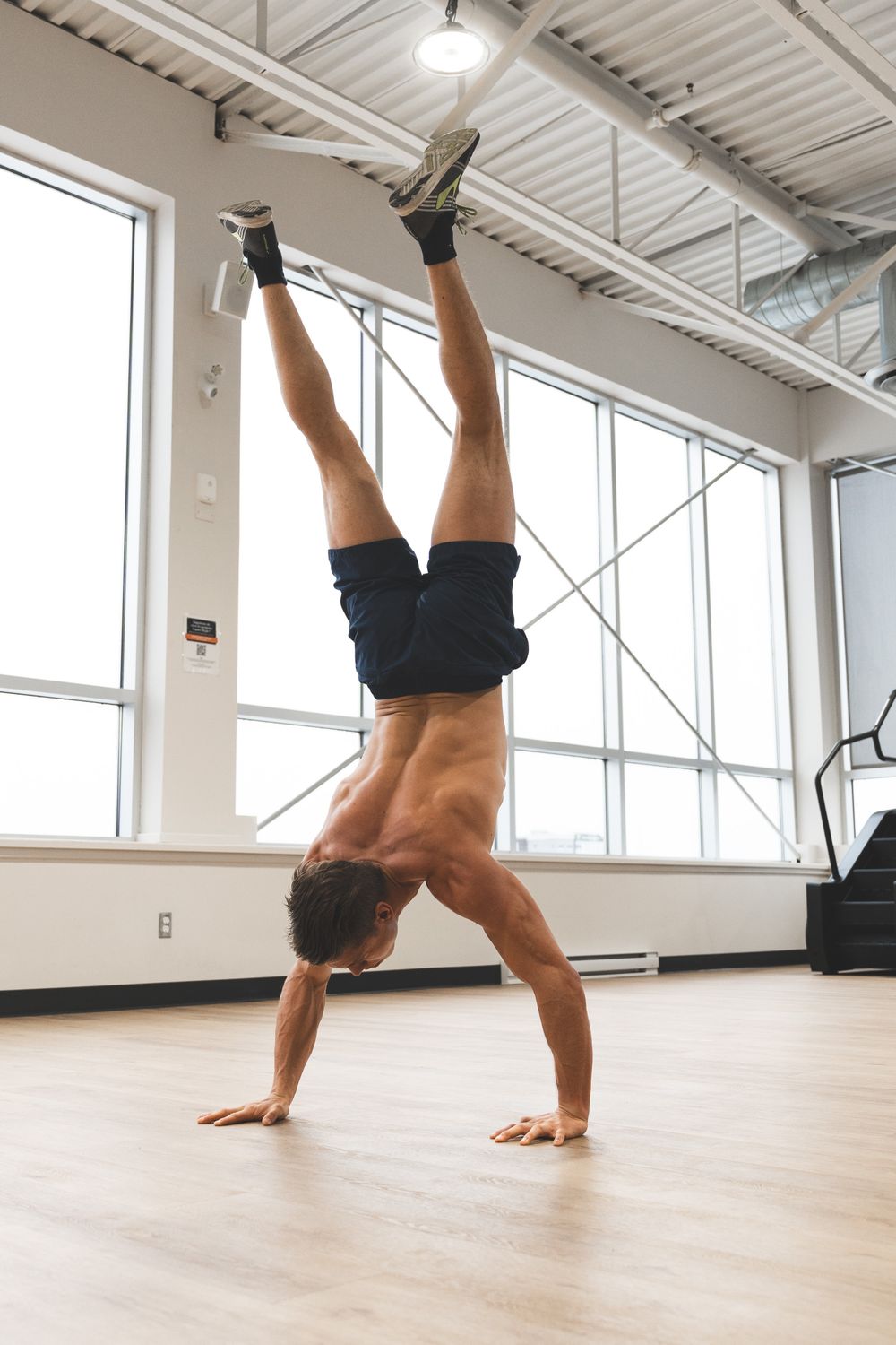 Button Handstand Muscular Shirtless Man Doing a Handstand · Free Stock Photo