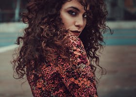 Photo Of Woman In White Sweater Sitting On Concrete Riverbank Photo Of Woman In White Sweater Sitting On Concrete Riverbank Images, Photos, Reviews
