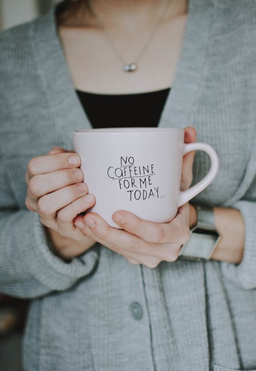 Free Woman Holding No Coffeine for Me Today-printed Ceramic Mug Stock Photo